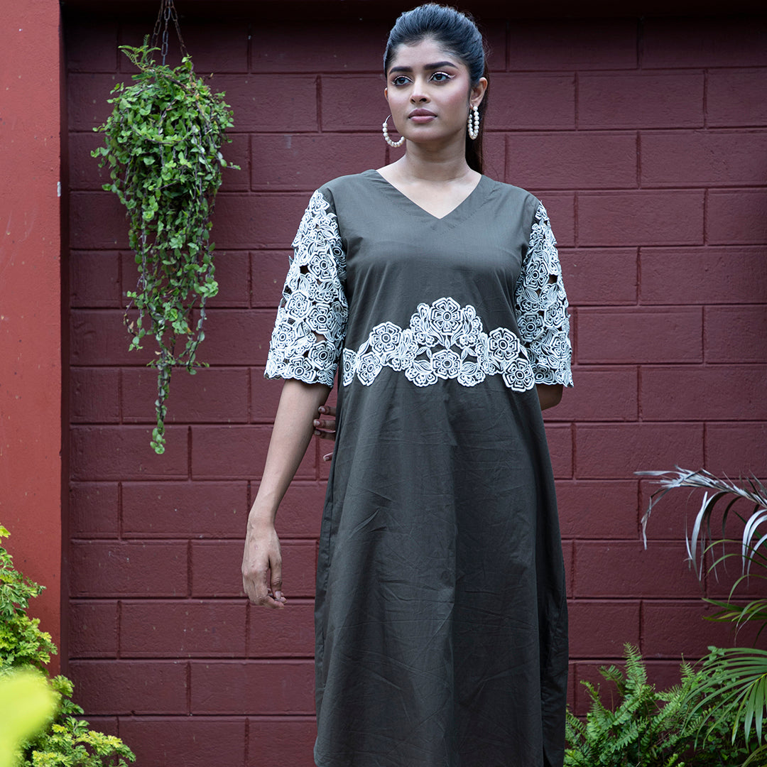 Cutwork dress with stylish belt