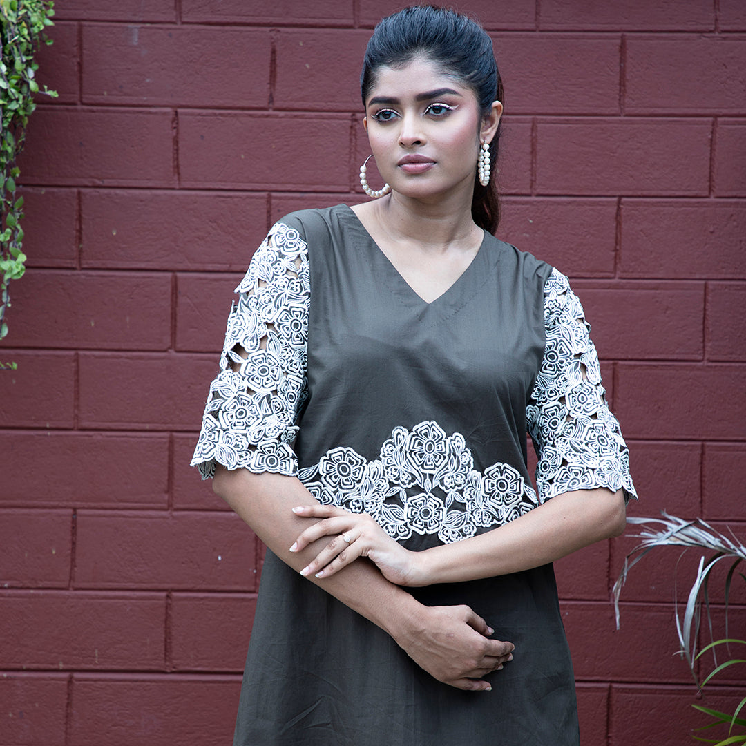 Cutwork dress with stylish belt