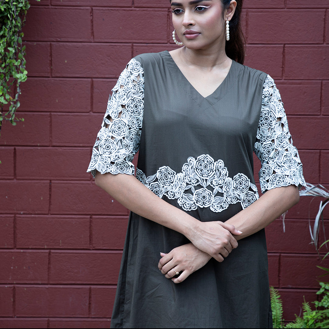 Cutwork dress with stylish belt