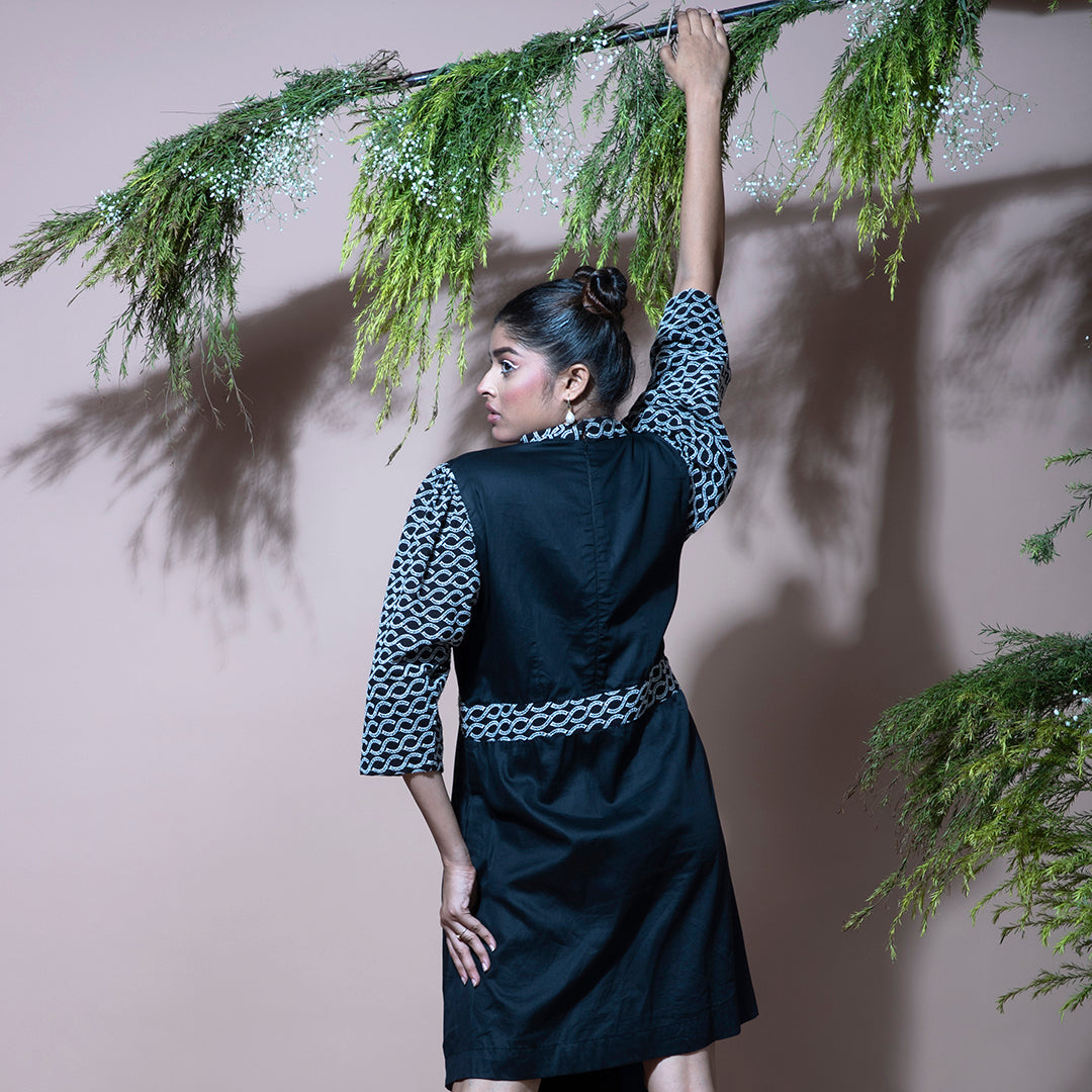 Black dress with cutwork embroidery sleeves