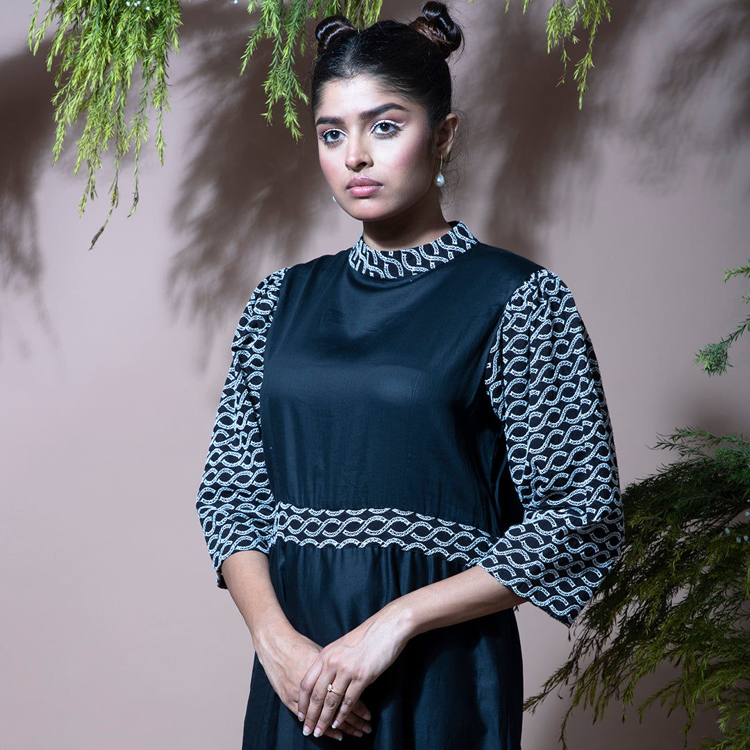 Black dress with cutwork embroidery sleeves