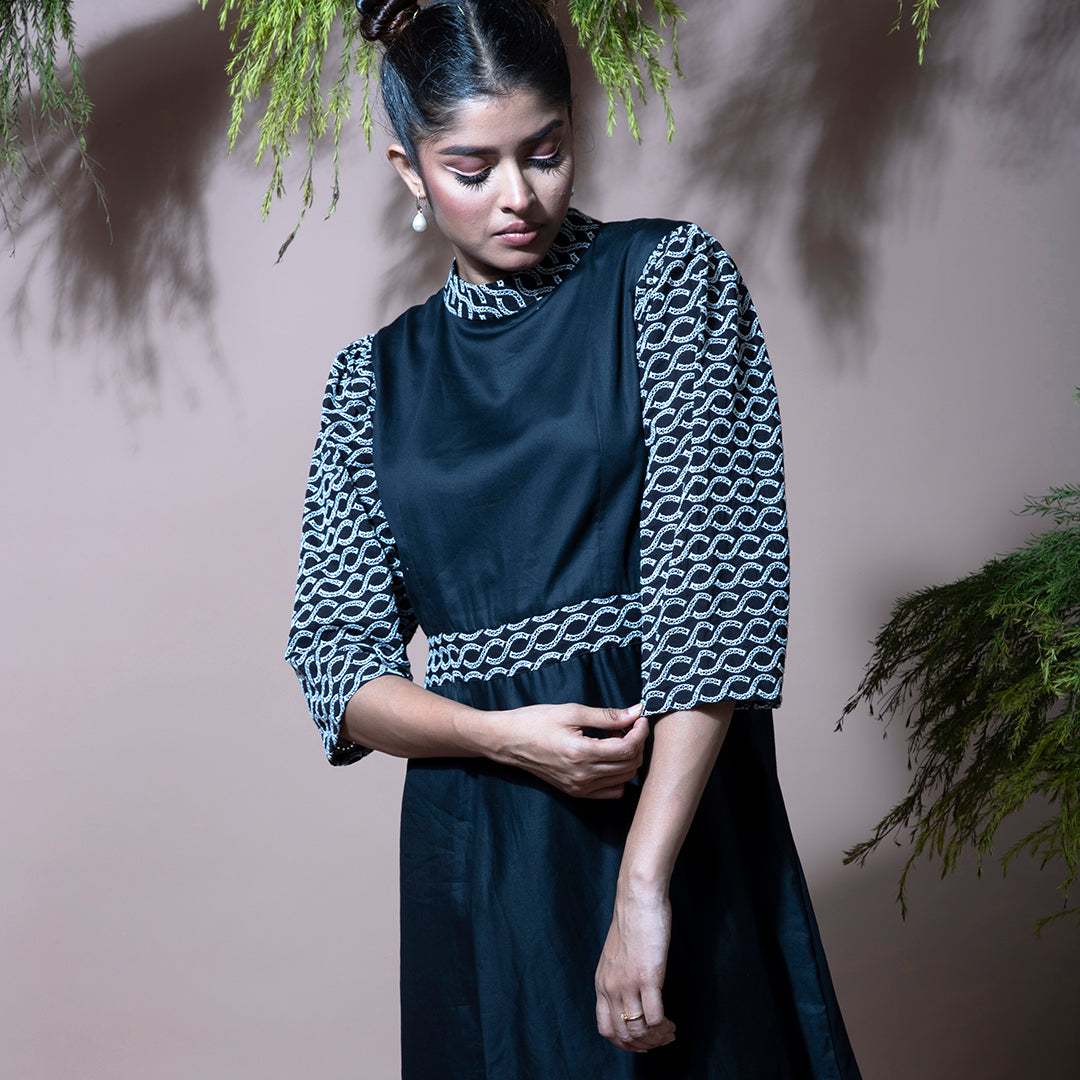 Black dress with cutwork embroidery sleeves