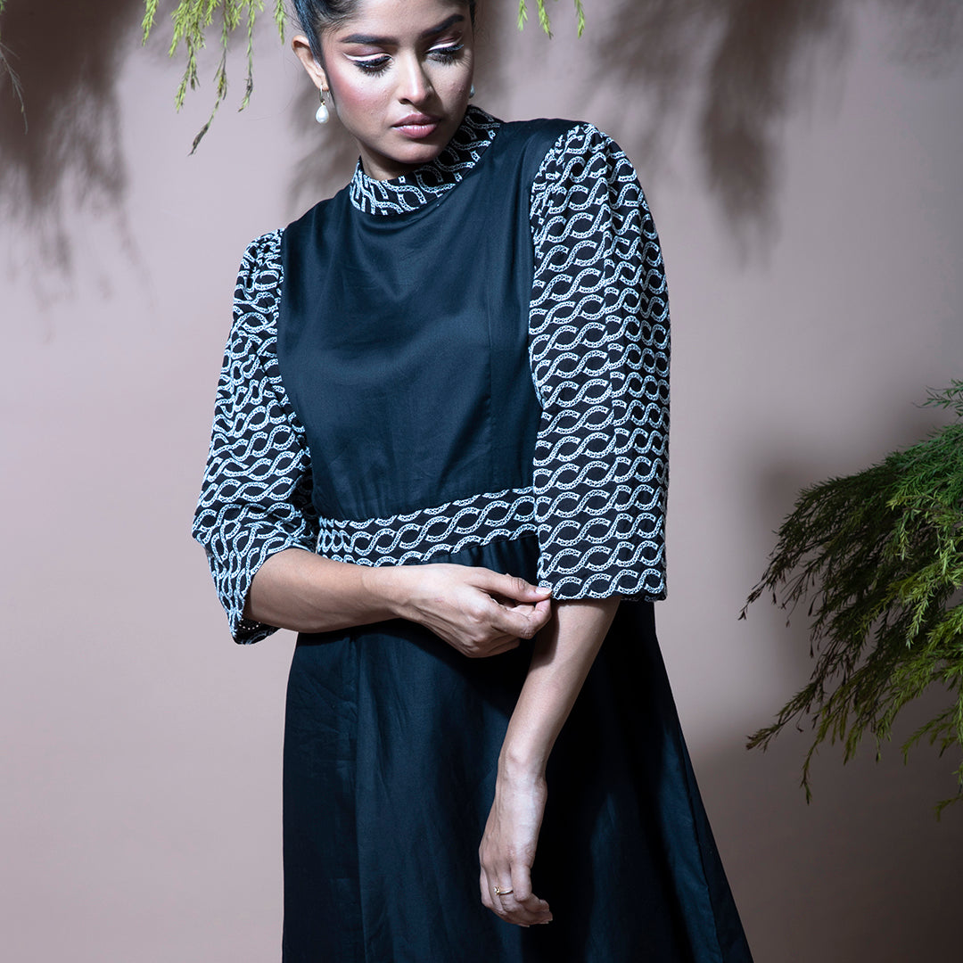 Black dress with cutwork embroidery sleeves